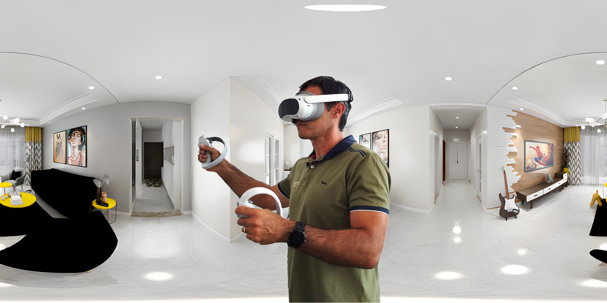 Un ricercatore esplora un ambiente interno ricreato in realtà virtuale con un visore e due controller, immerso in una stanza panoramica a 360°.